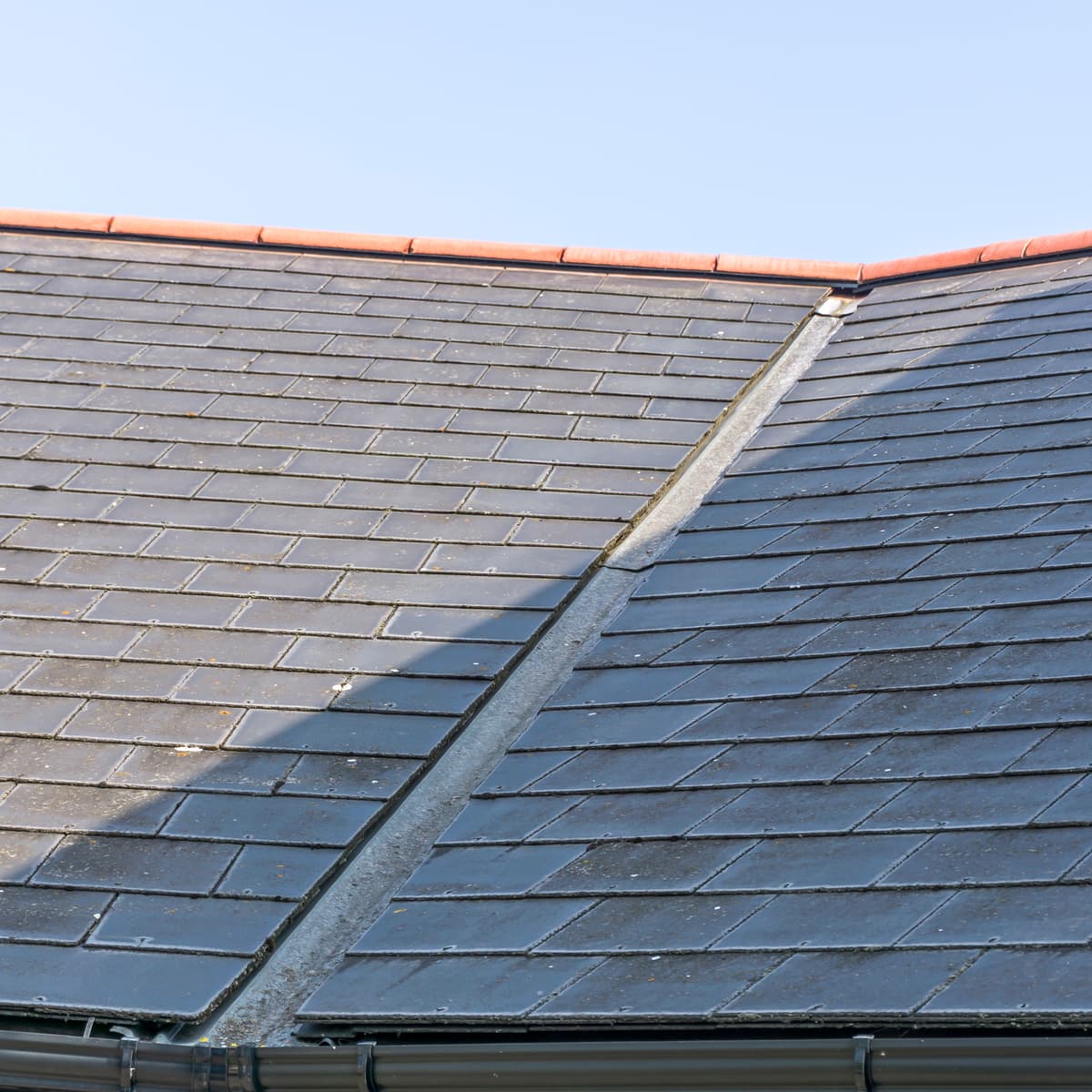 Slate roof ridge and lead valley